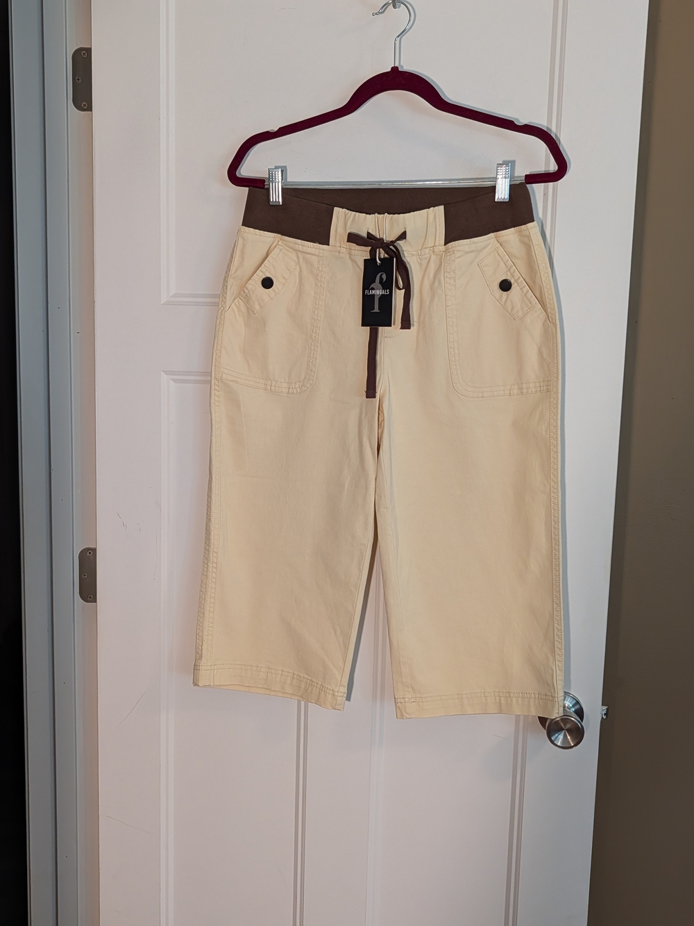 Brand New With Tags. Women's Cream Capris with Brown Waistband. Sz Med.
